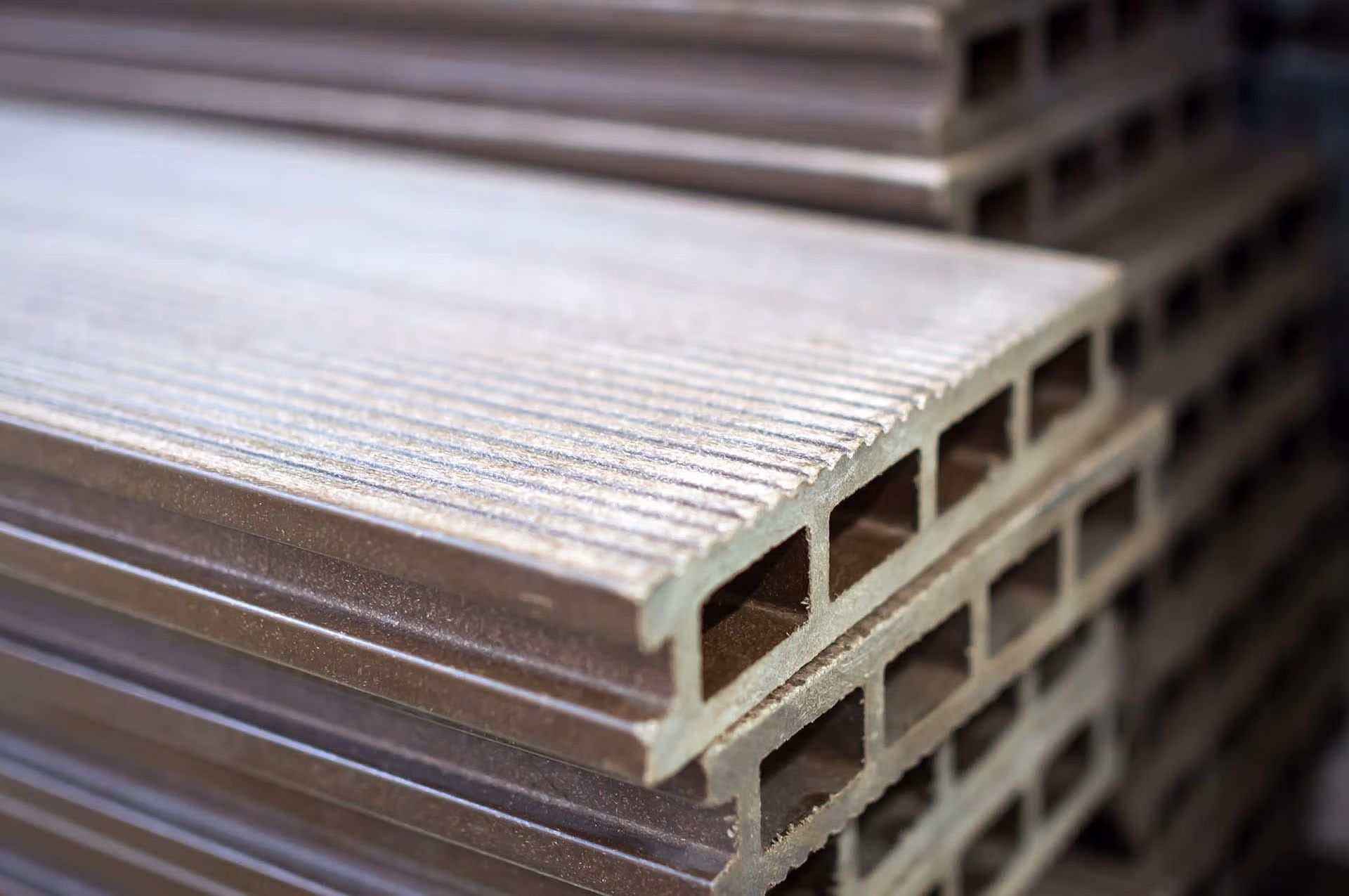 Composite decking polymer board stacked - Composites Alternatives