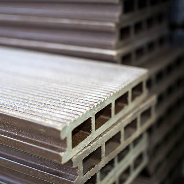 Composite decking polymer board stacked - Composites Alternatives