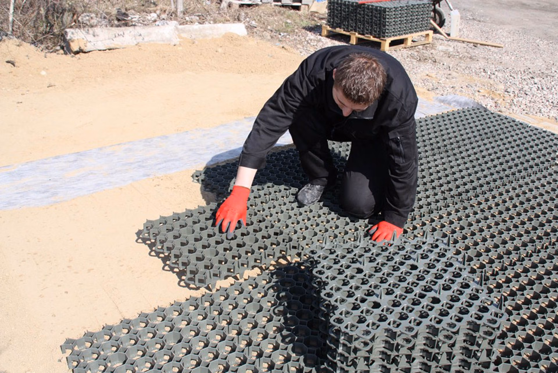 elite-grass-grid-composite-alternative-ground-reinforcement-stabilisation-installation-man